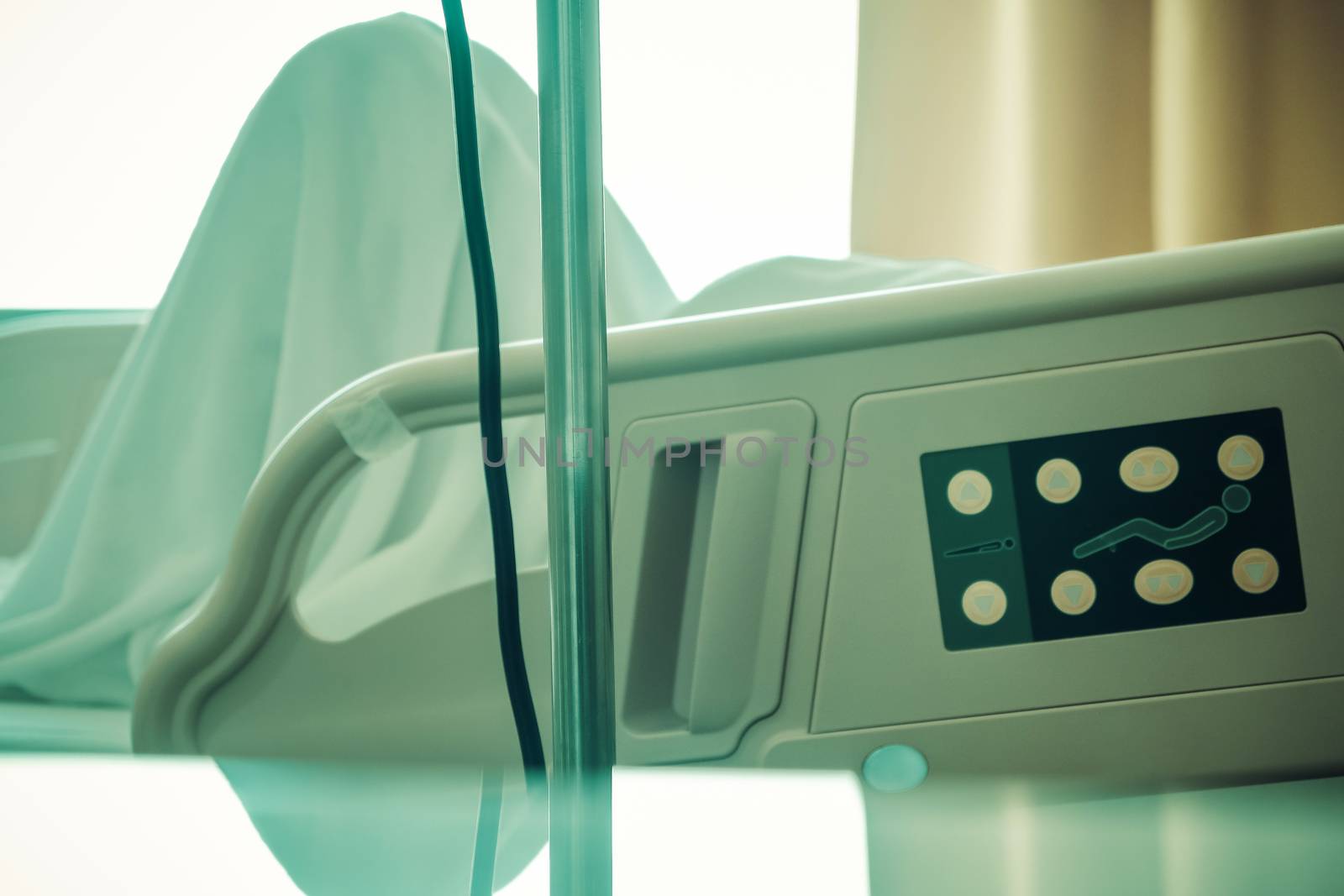 Close up of Patient bed with Elderly patients in hospital