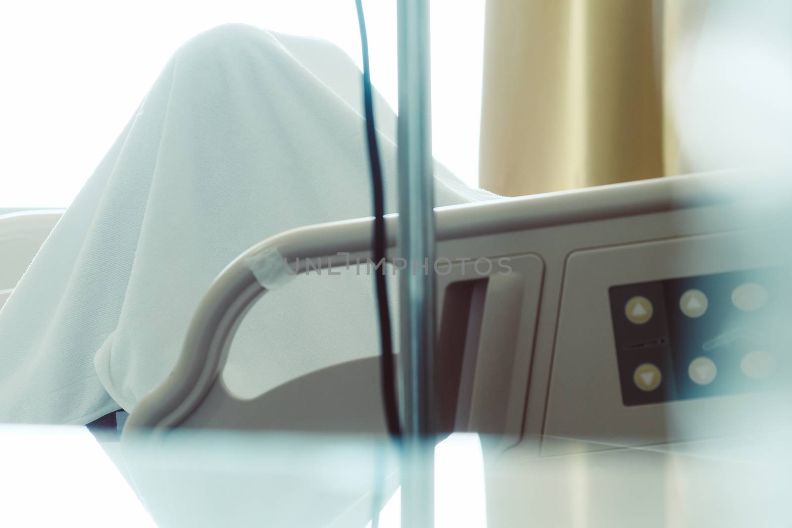Close up of Patient bed with Elderly patients in hospital
