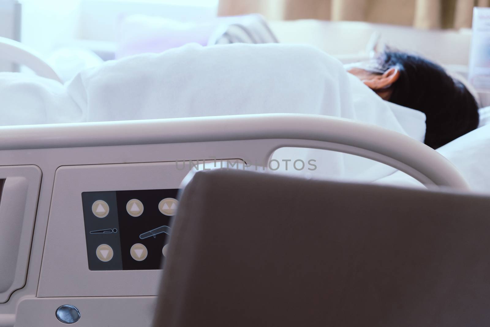 Close up of Patient bed with Elderly patients in hospital