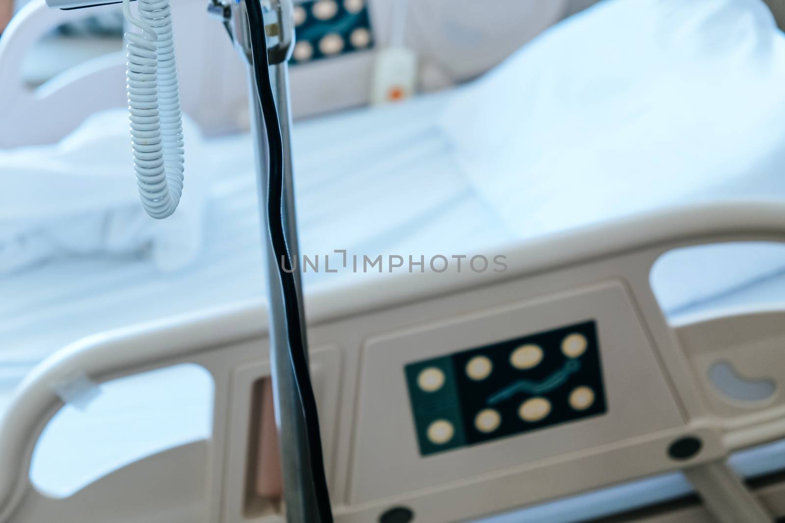 Close up of Patient bed with Elderly patients in hospital
