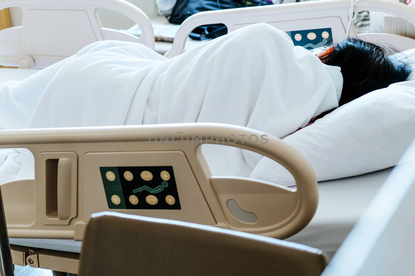 Close up of Patient bed with Elderly patients in hospital