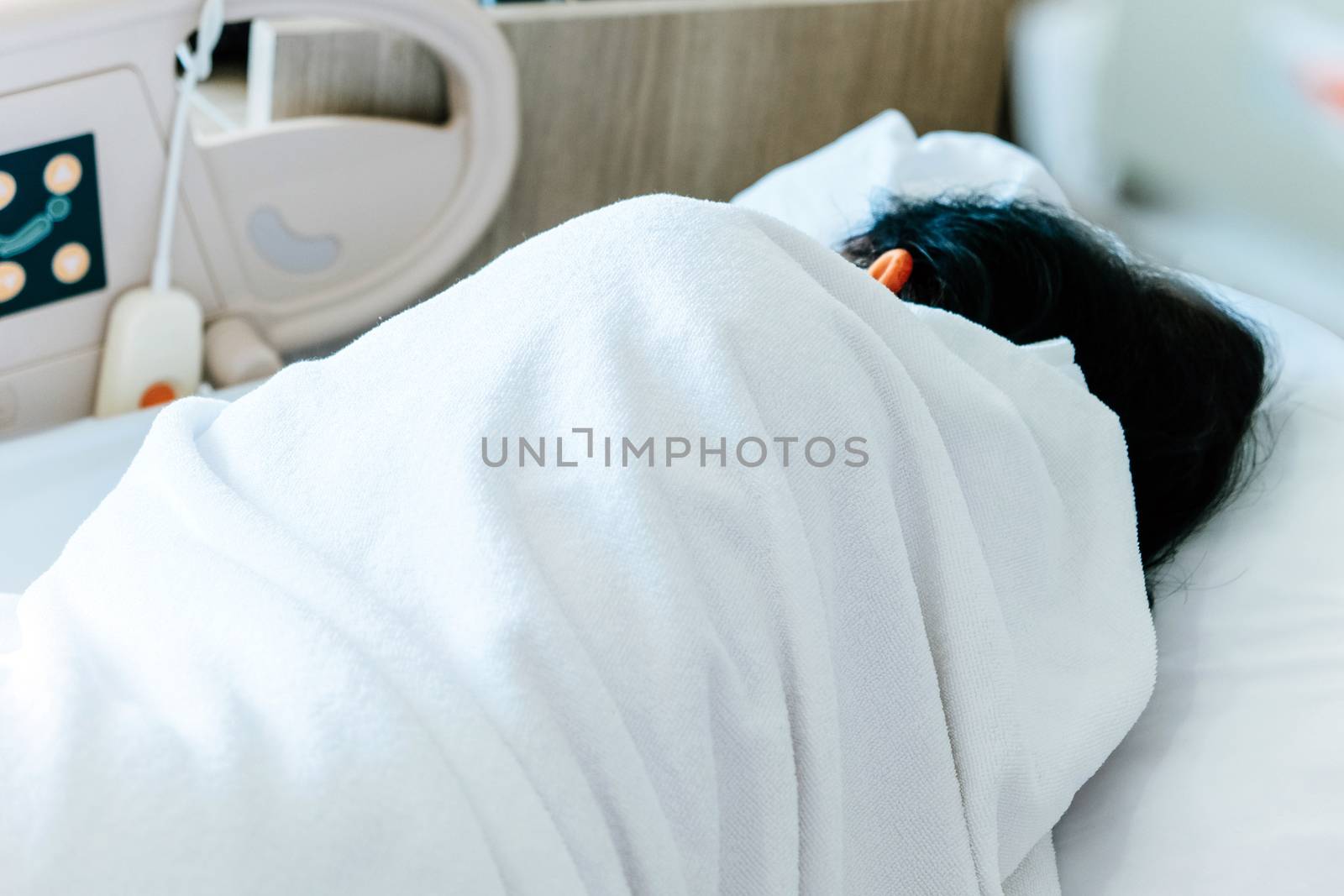 Close up of Patient bed with Elderly patients in hospital