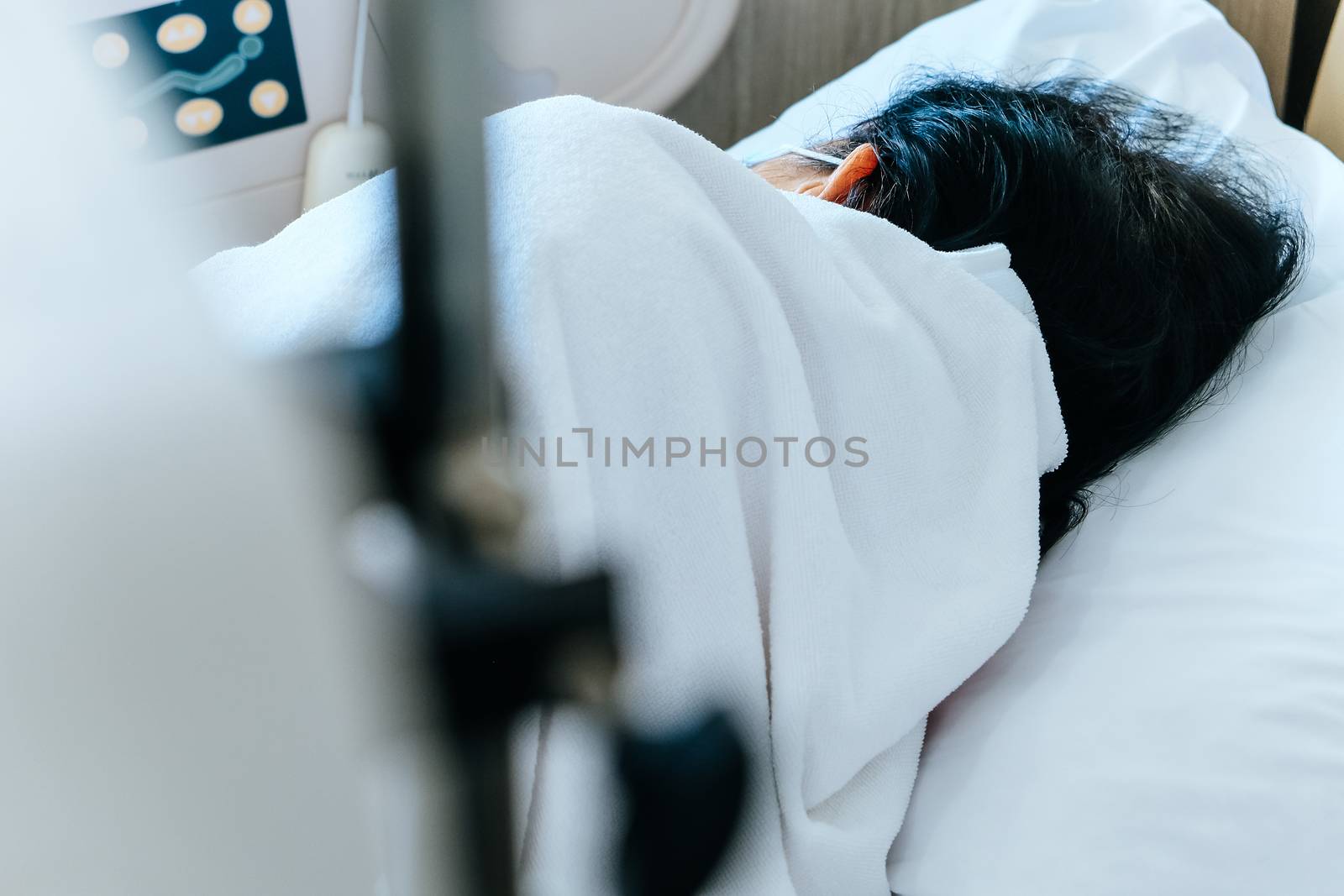 Close up of Patient bed with Elderly patients in hospital