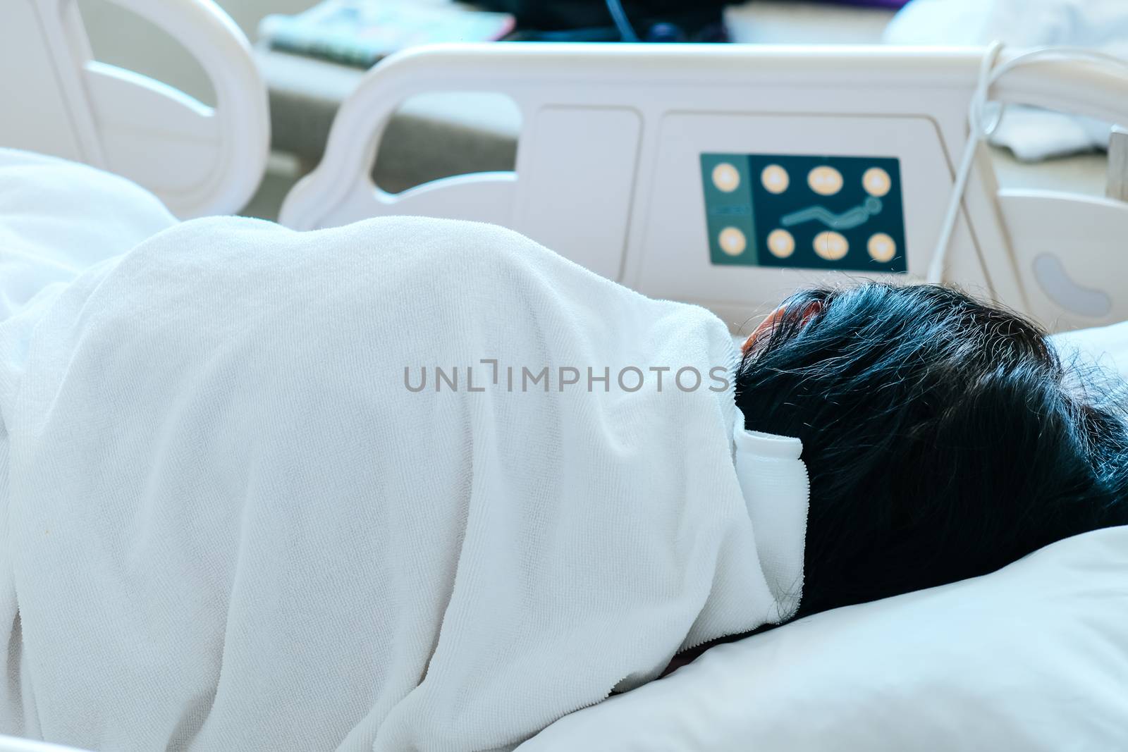 Close up of Patient bed with Elderly patients in hospital