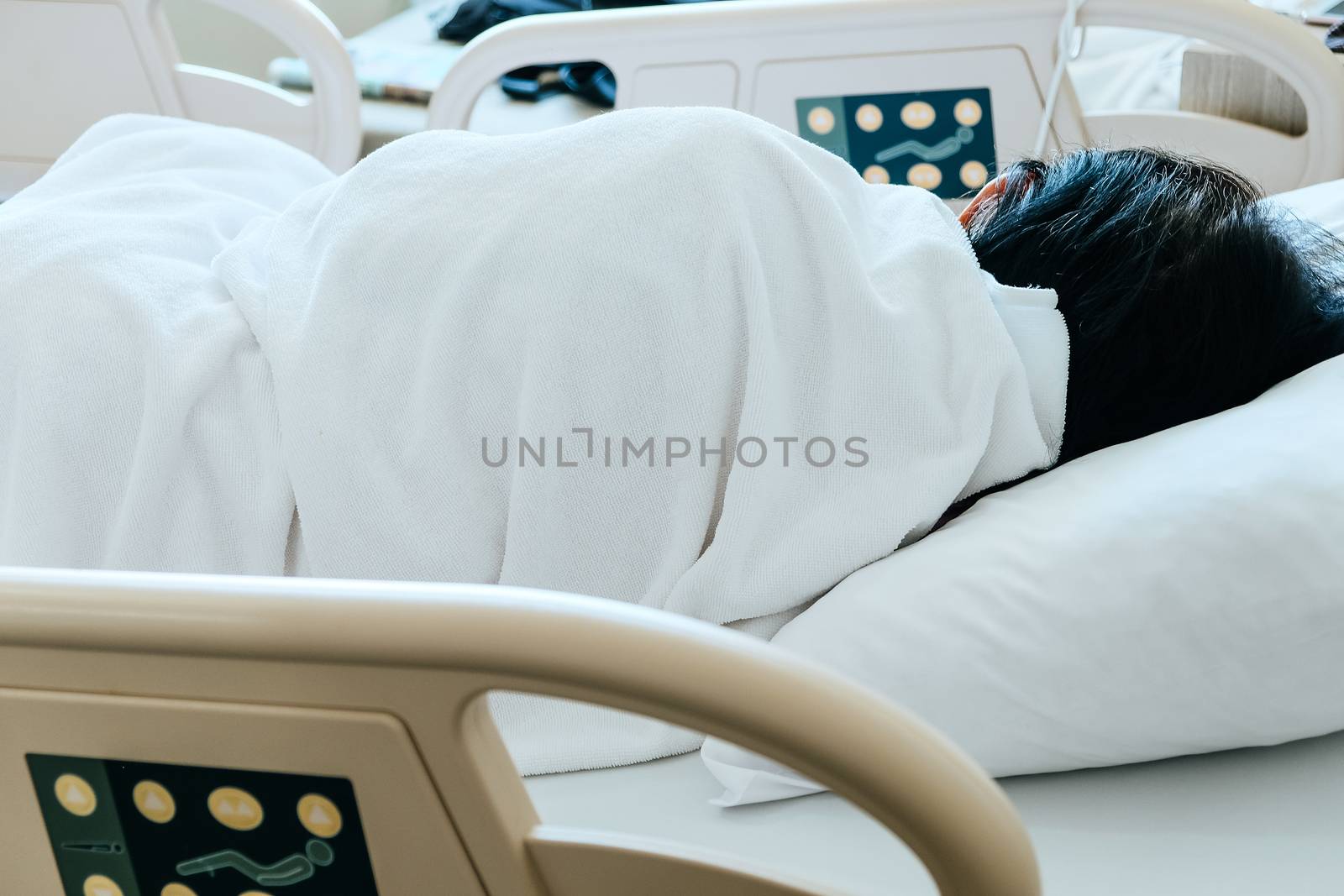 Close up of Patient bed with Elderly patients in hospital