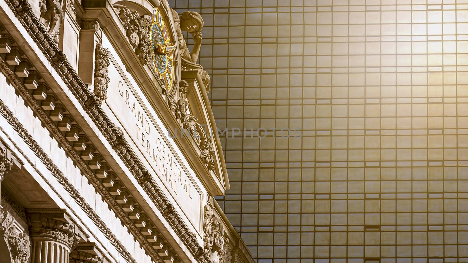 New York, USA, November 2016: exterior of the Grand Central Terminal in New York with the large clock surrounded by the statues of the Greek gods Minerva, Hercules and Mercury