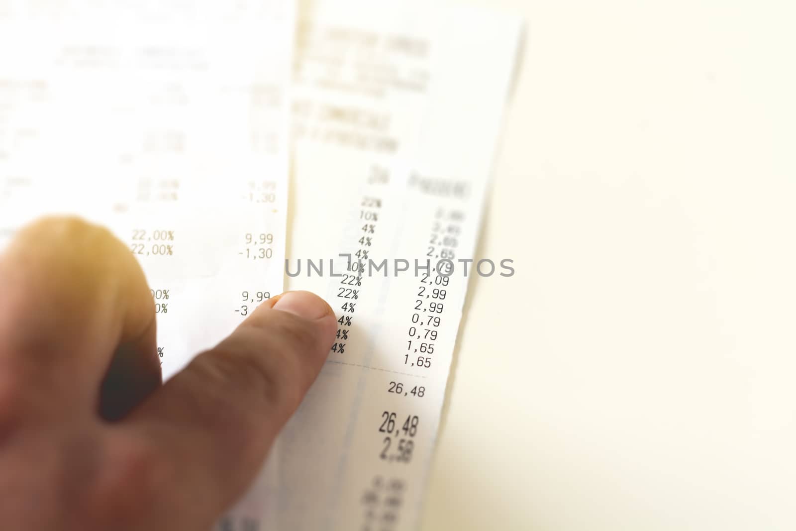 checking a receipt by analyzing the numbers, expenses and profits. by rarrarorro