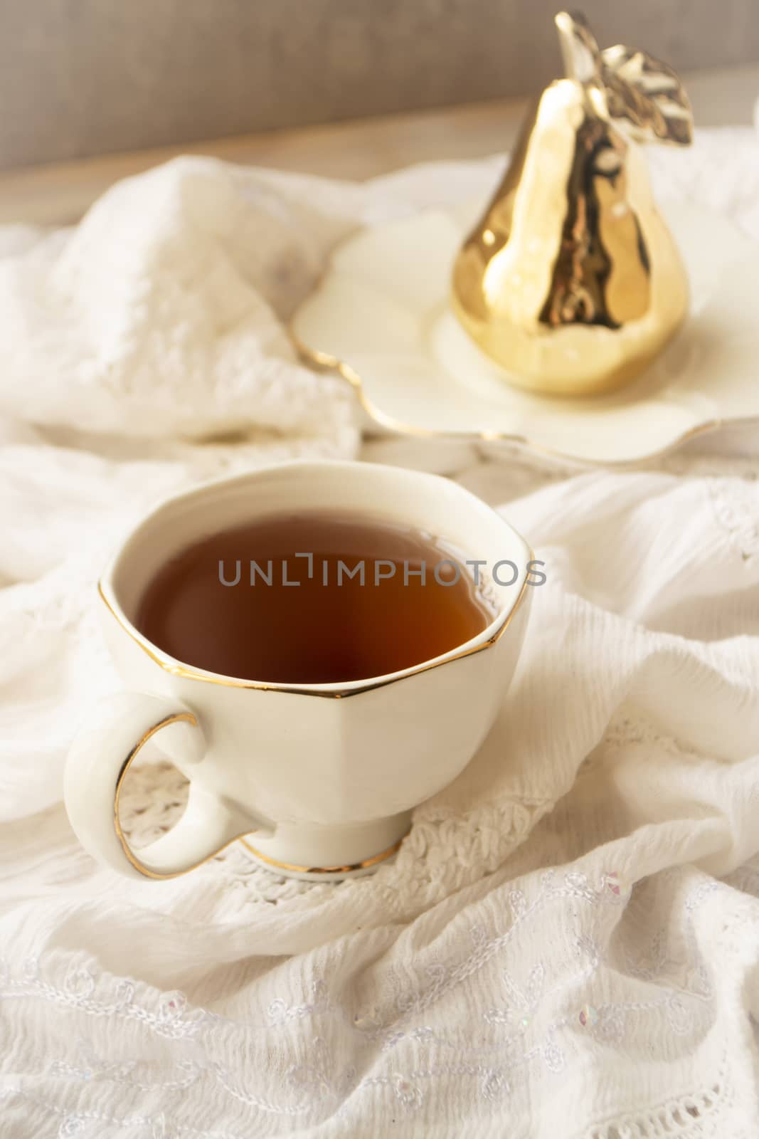Afternoon tea in white vintage cup, vertical image