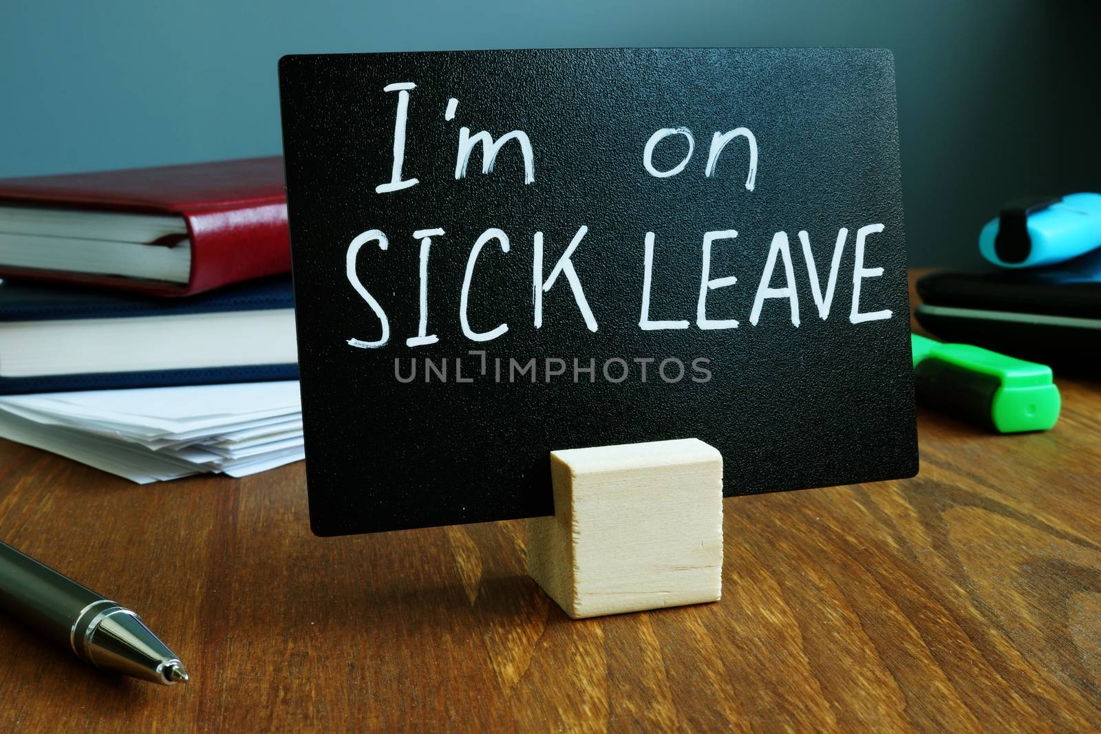 I am on sick leave sign on the workplace.