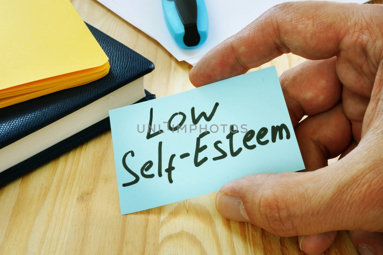 Low Self esteem sign in the hand. by designer491