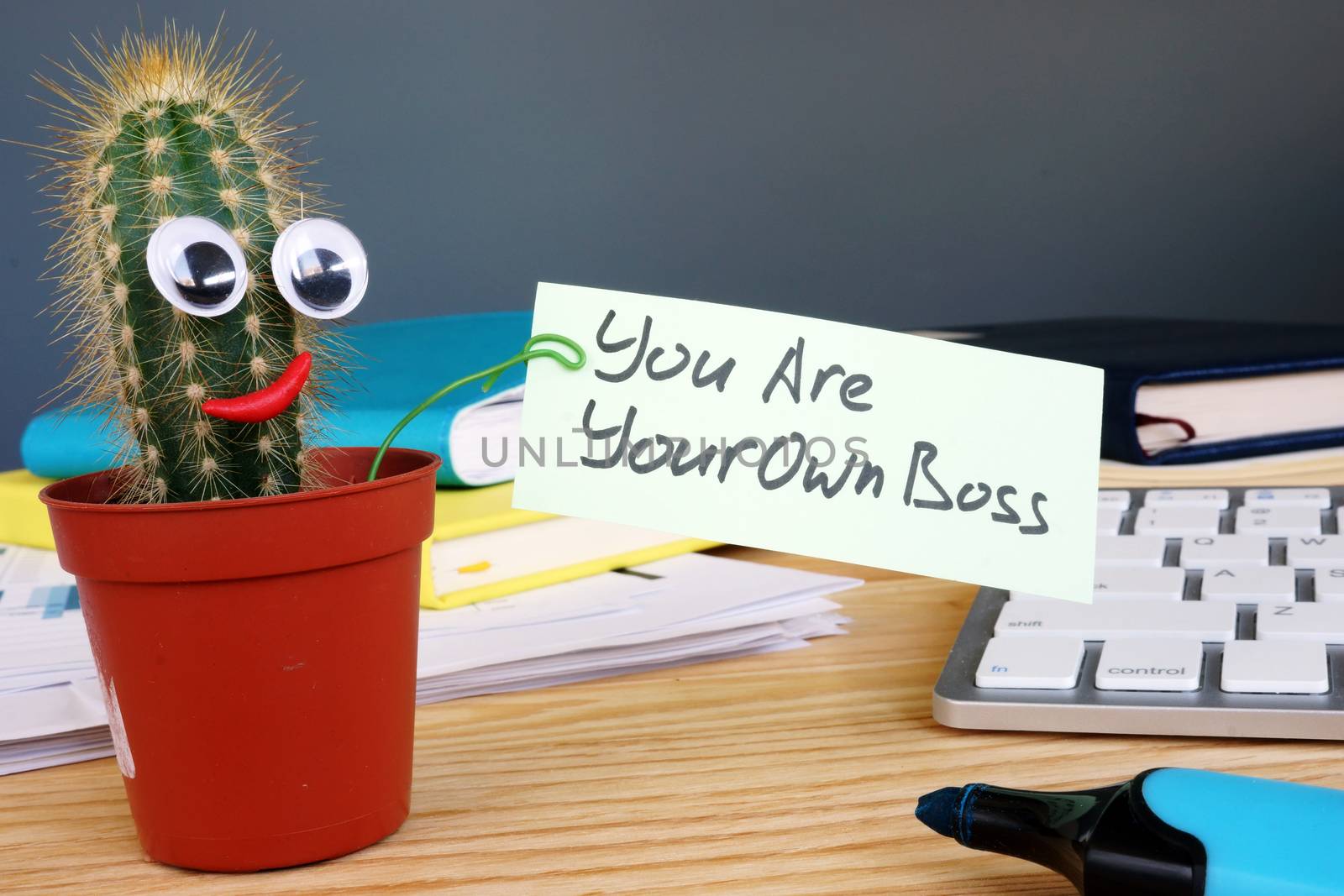 You are your own boss sign on the desk. by designer491