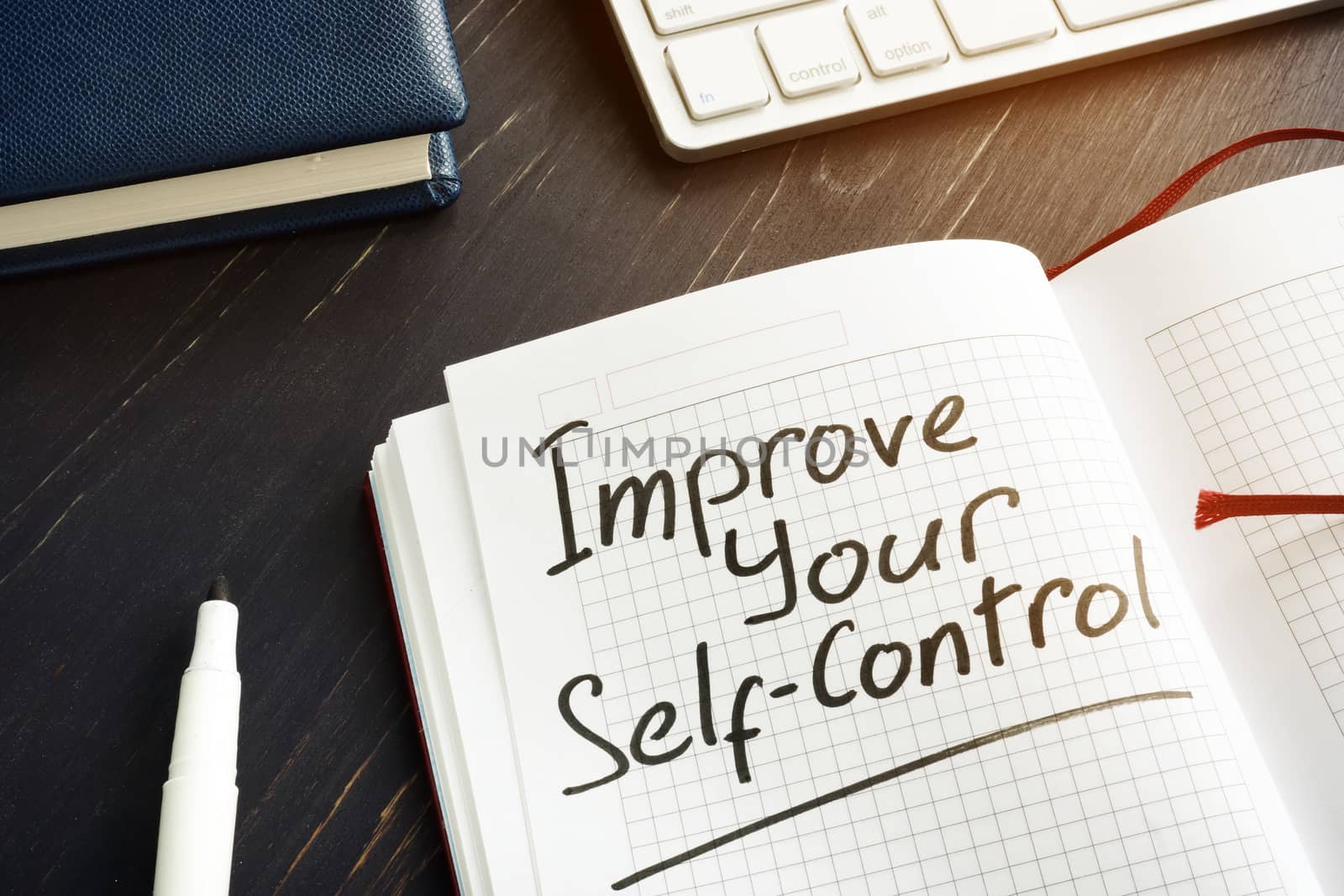 Improve Your Self-Control sign in the red notebook.