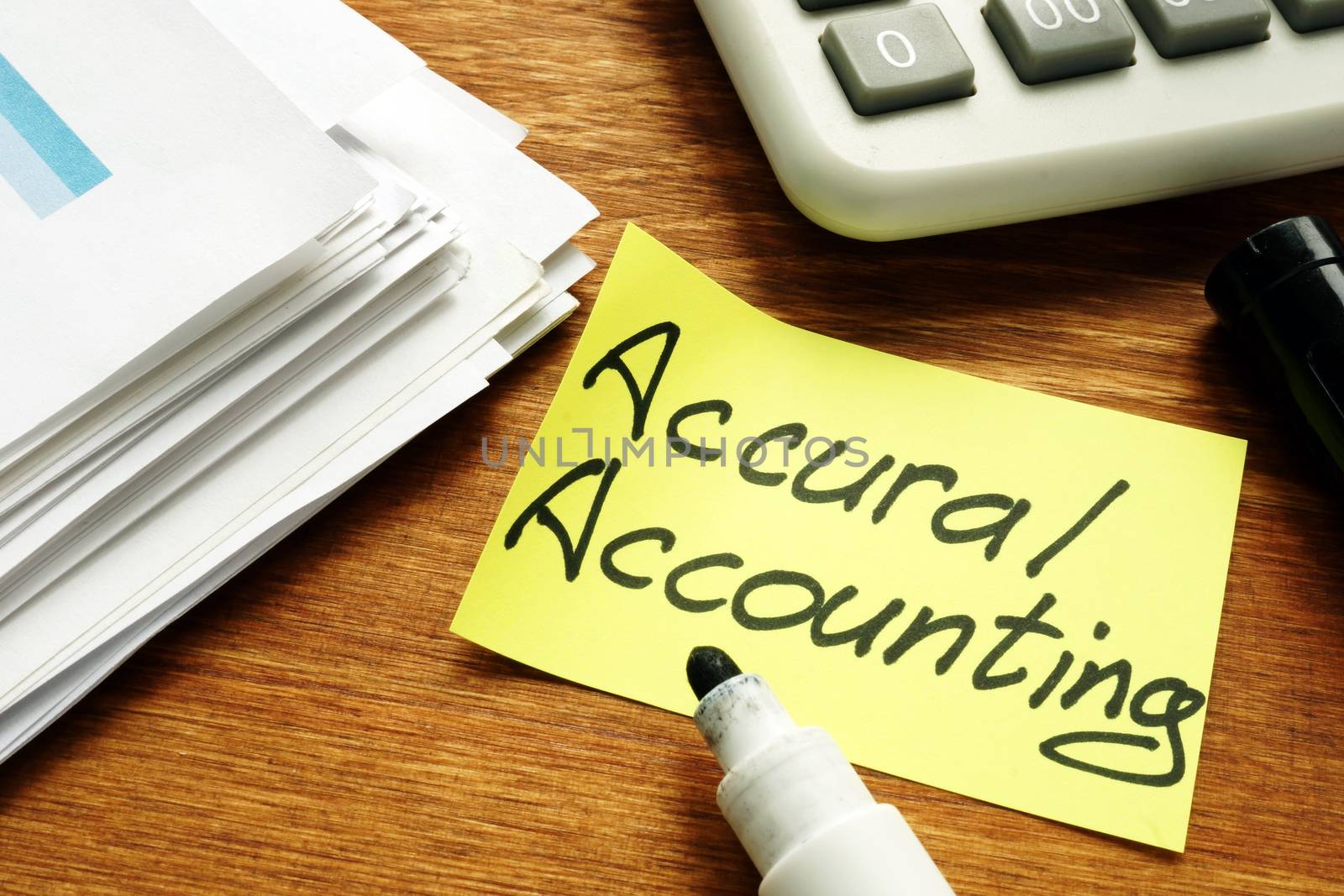 Accrual Accounting concept. Business report and calculator.