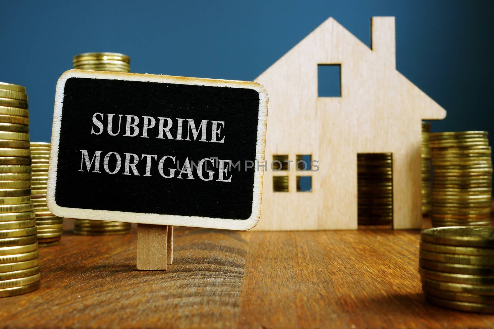 Subprime mortgage plate and model of home. by designer491