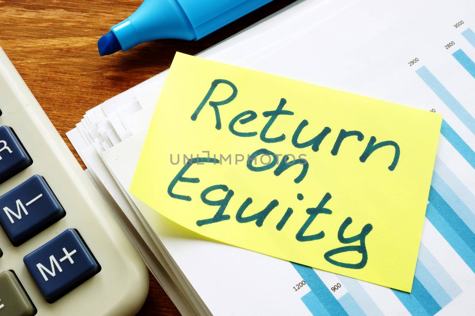 Return on equity inscription and pile of business documents. by designer491