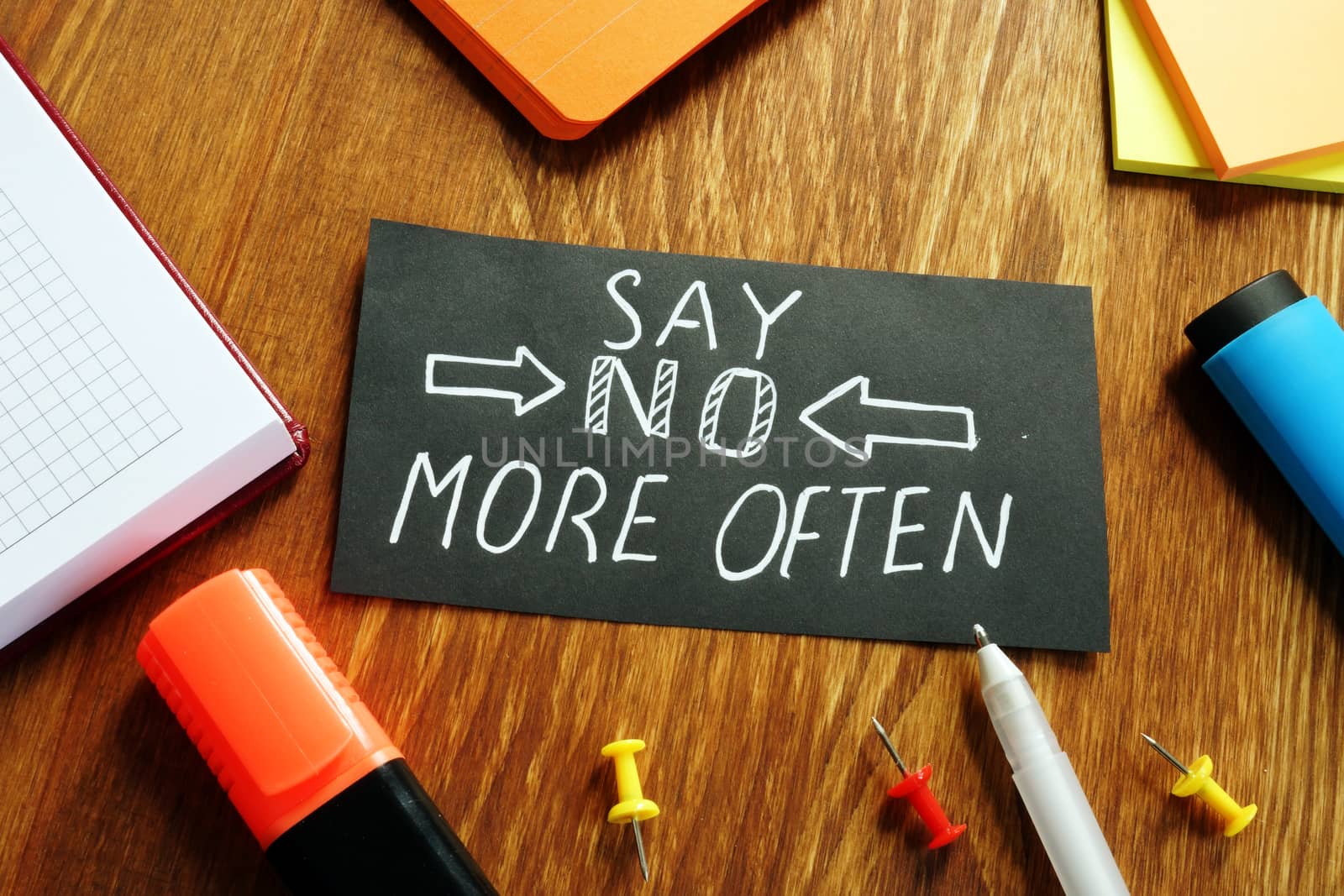 Learn to say no more often sign on the piece of paper. by designer491