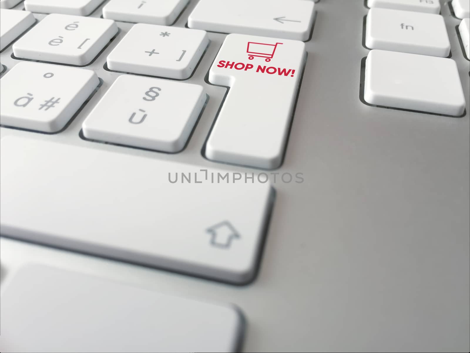 Close up of a computer keyboard with a button with a red cart icon by rarrarorro