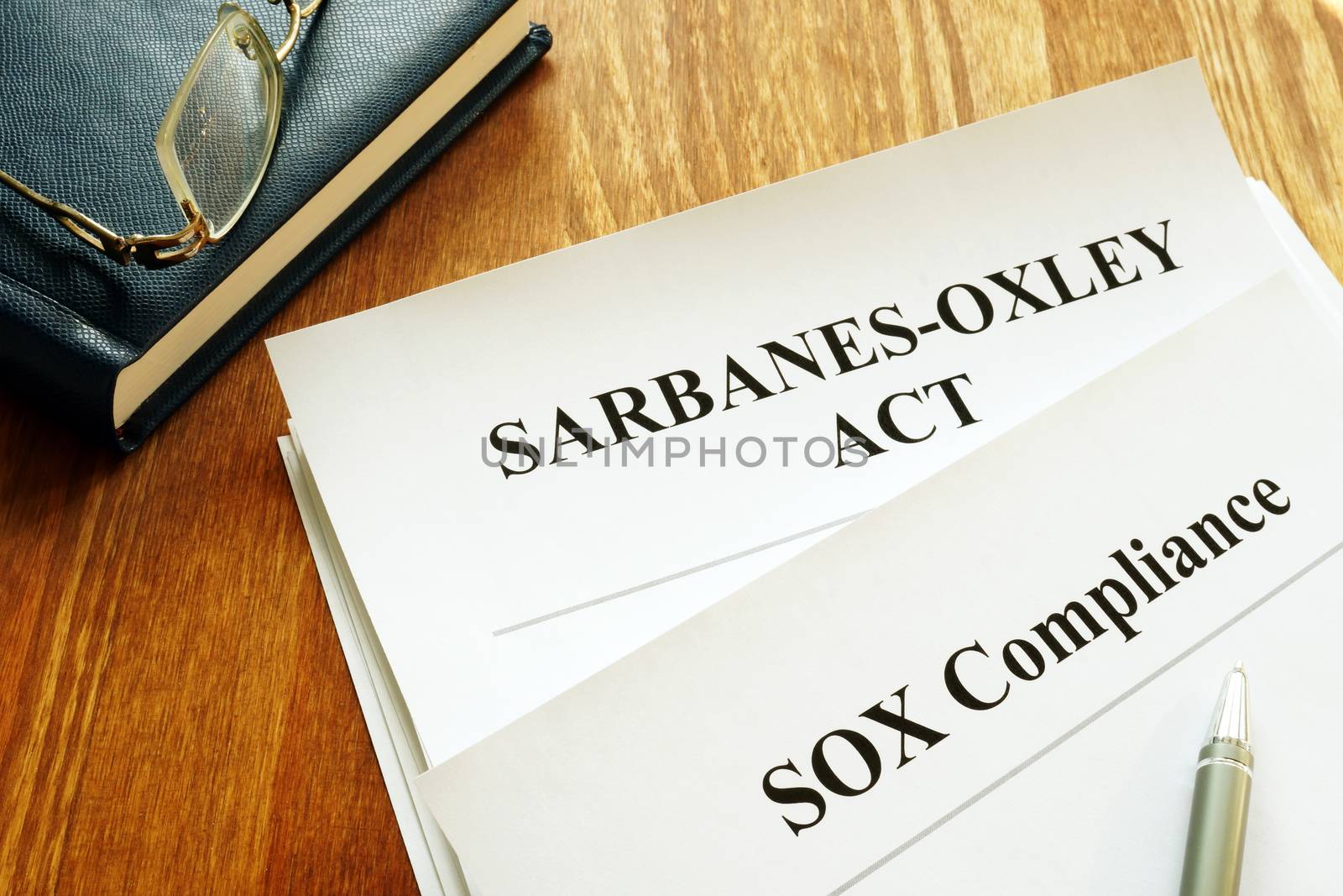 Sarbanes-Oxley Act and SOX compliance policy on table. by designer491