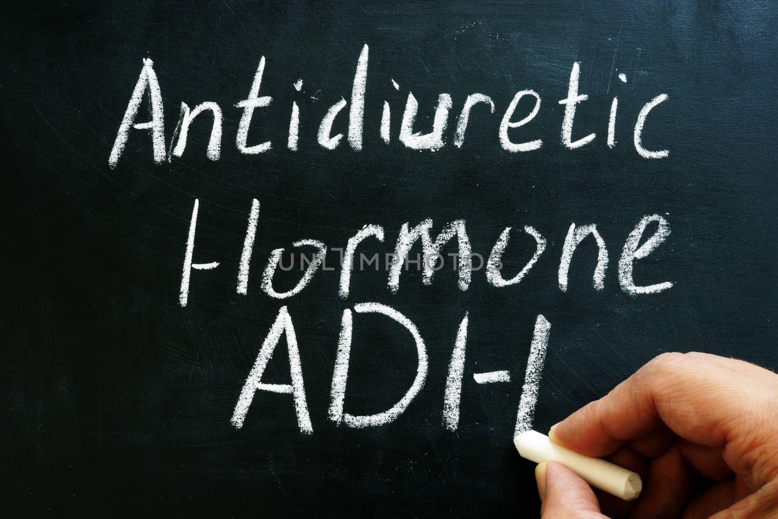 Antidiuretic hormone ADH or vasopressin sign on on the blackboard. by designer491