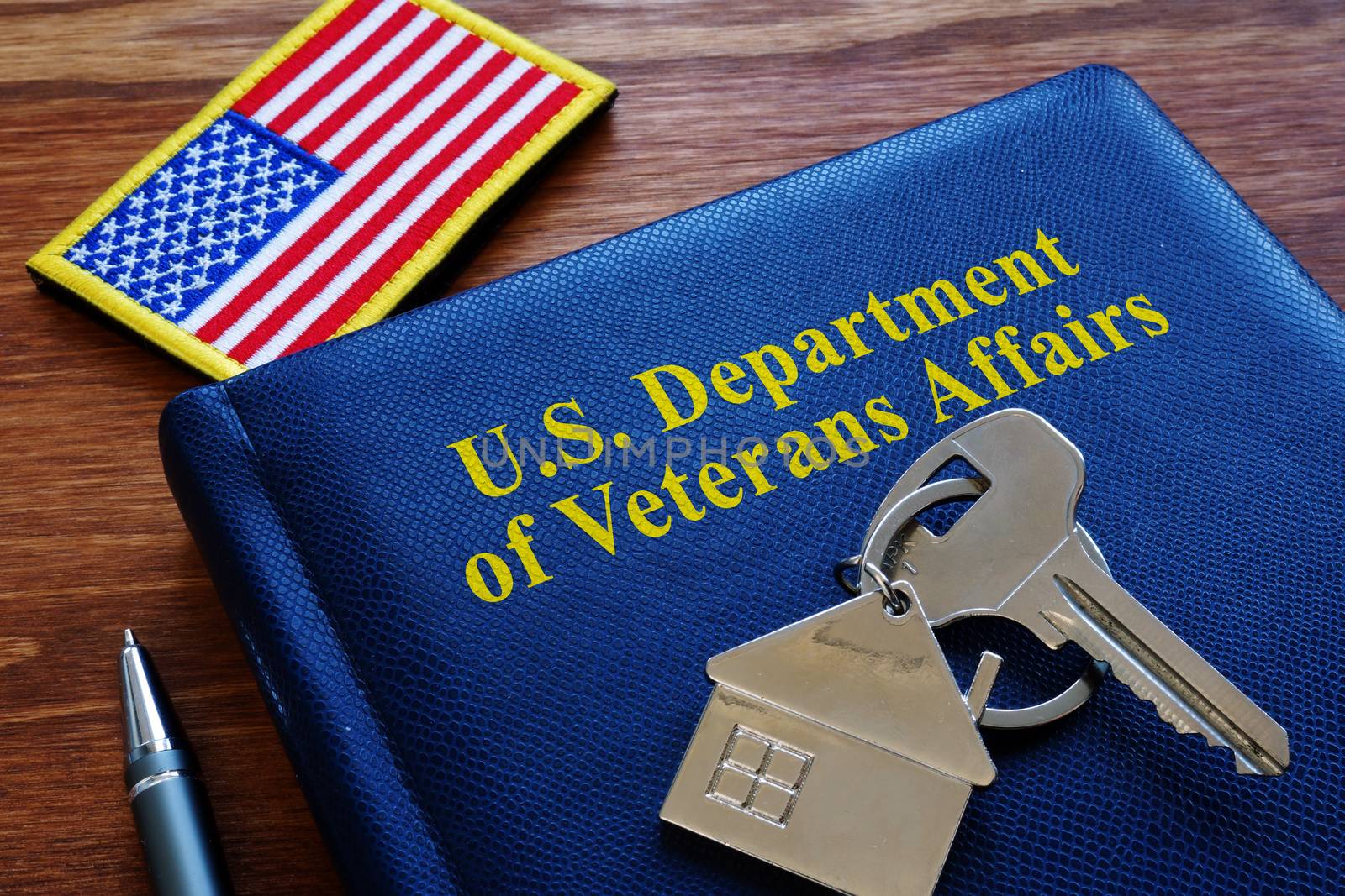 VA loan US Department of Veterans Affairs documents and flag. by designer491