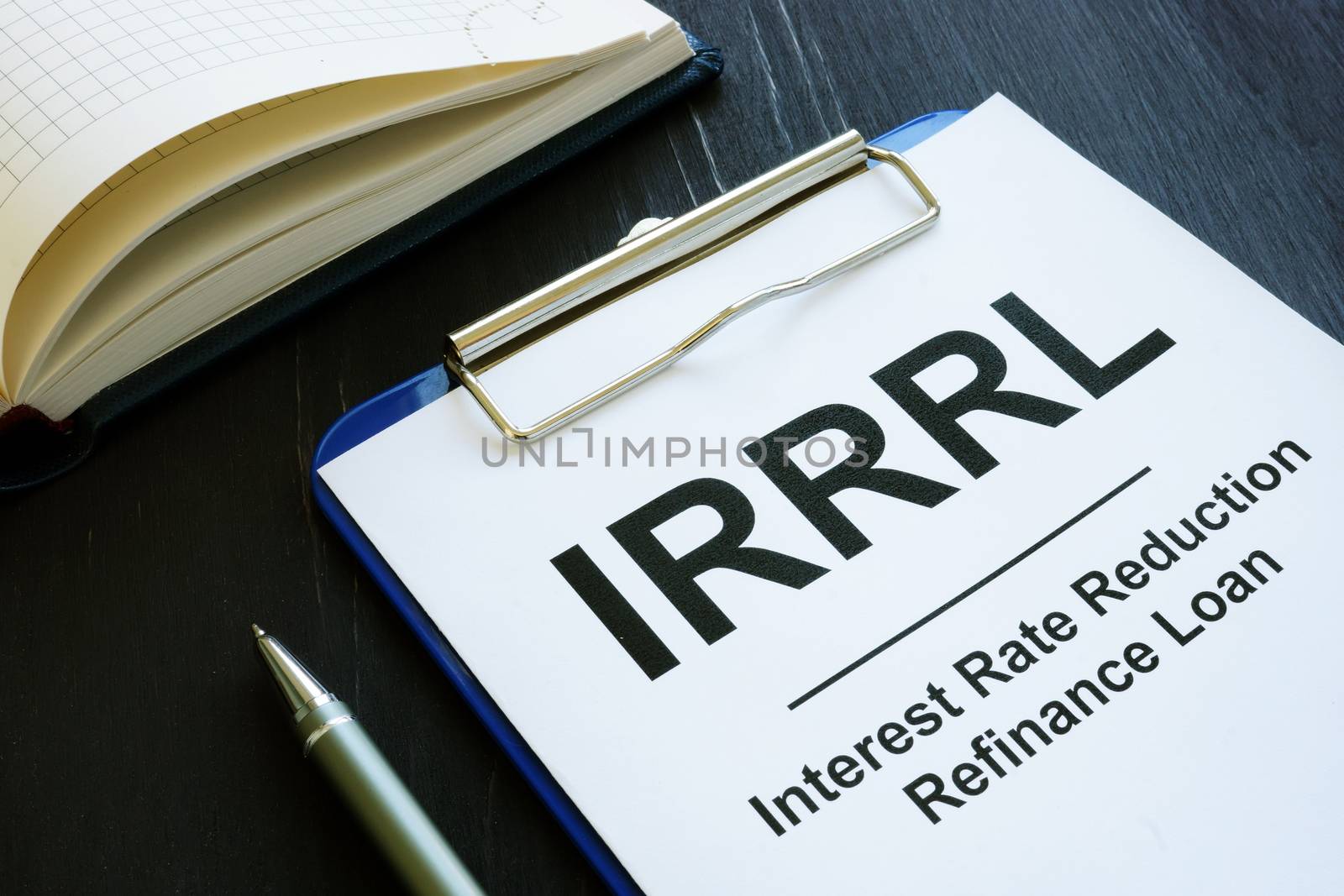 Interest rate reduction refinance loan IRRRL papers and pen.