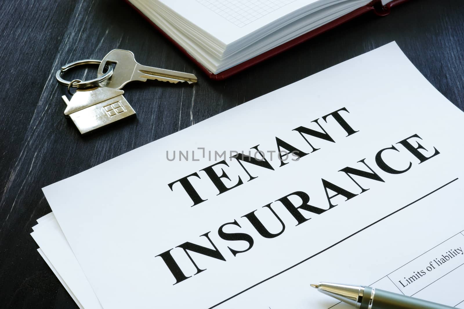 Tenant insurance policy, key and pen for signing. by designer491