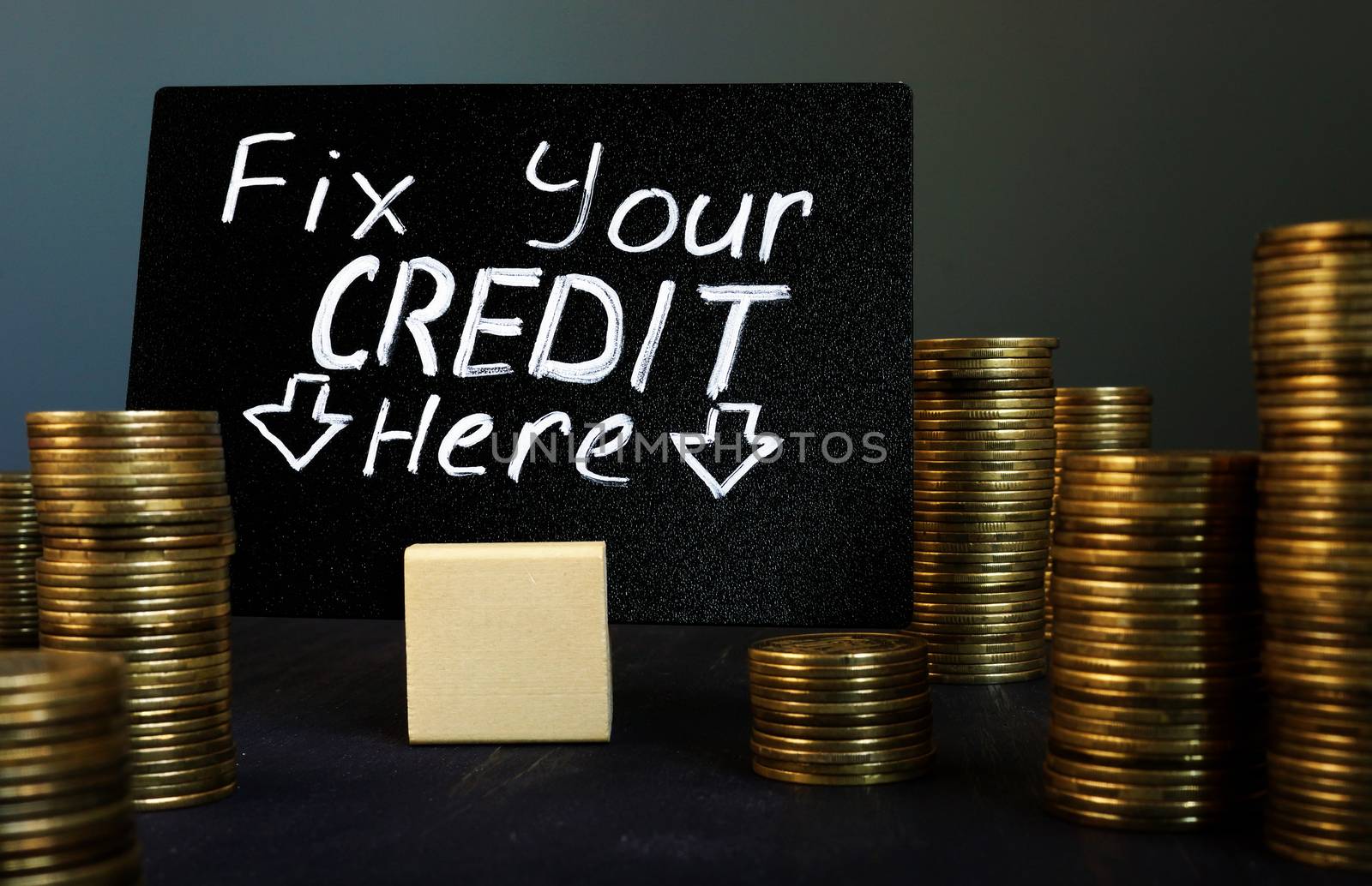 Fix your credit here handwritten sign and money.