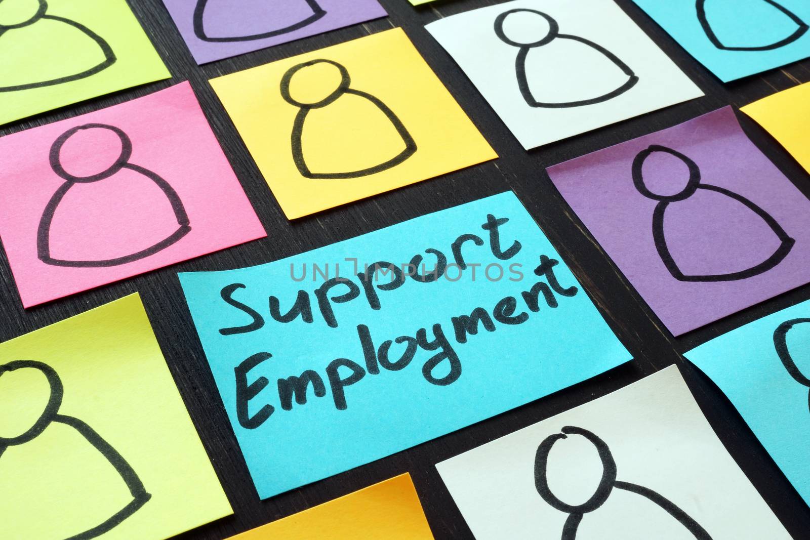 Support employment inscription and pieces of paper.