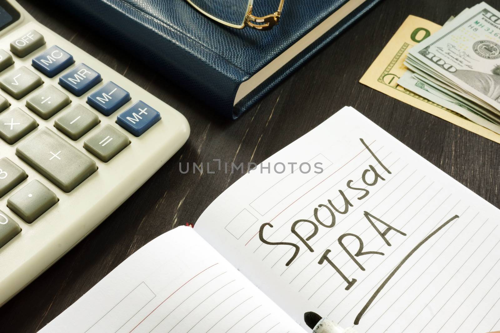 Spousal IRA inscription in the note. Retirement concept. by designer491