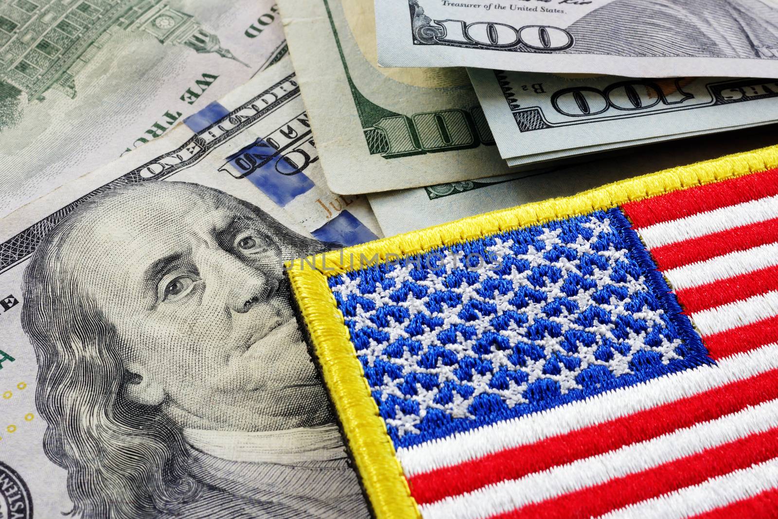 USA flag and money. Cash for VA loan from U.S. Department of Veterans Affairs. by designer491