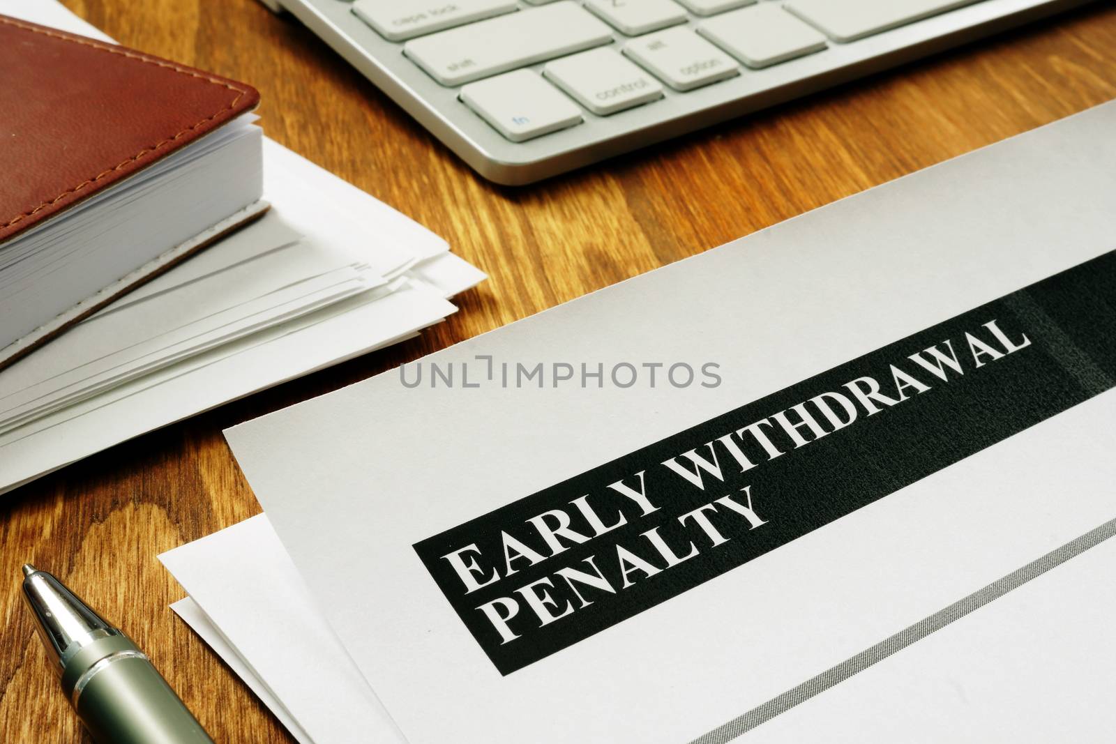 Early withdrawal penalty letter on the desk. by designer491