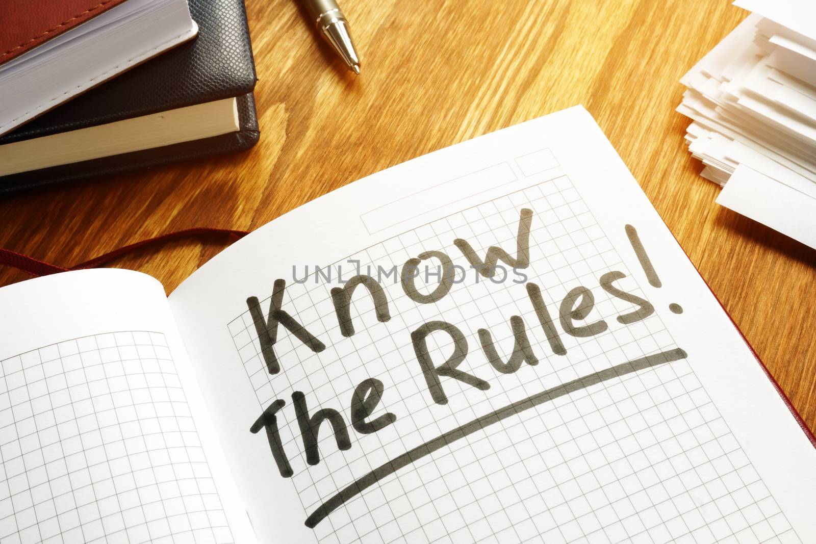 Know the rules of business law written on notebook.