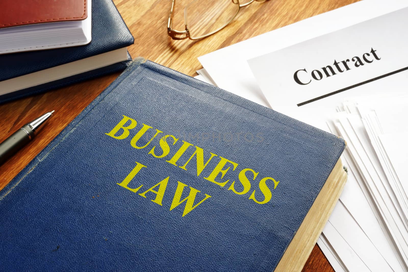 Business law book and corporate contract.