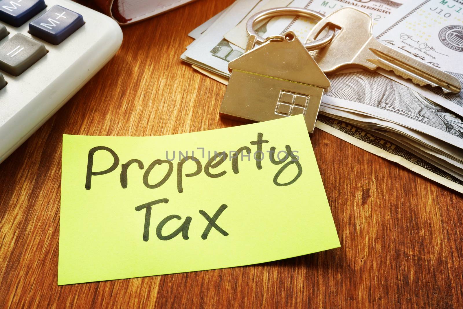 Property Tax, money and key from home. by designer491