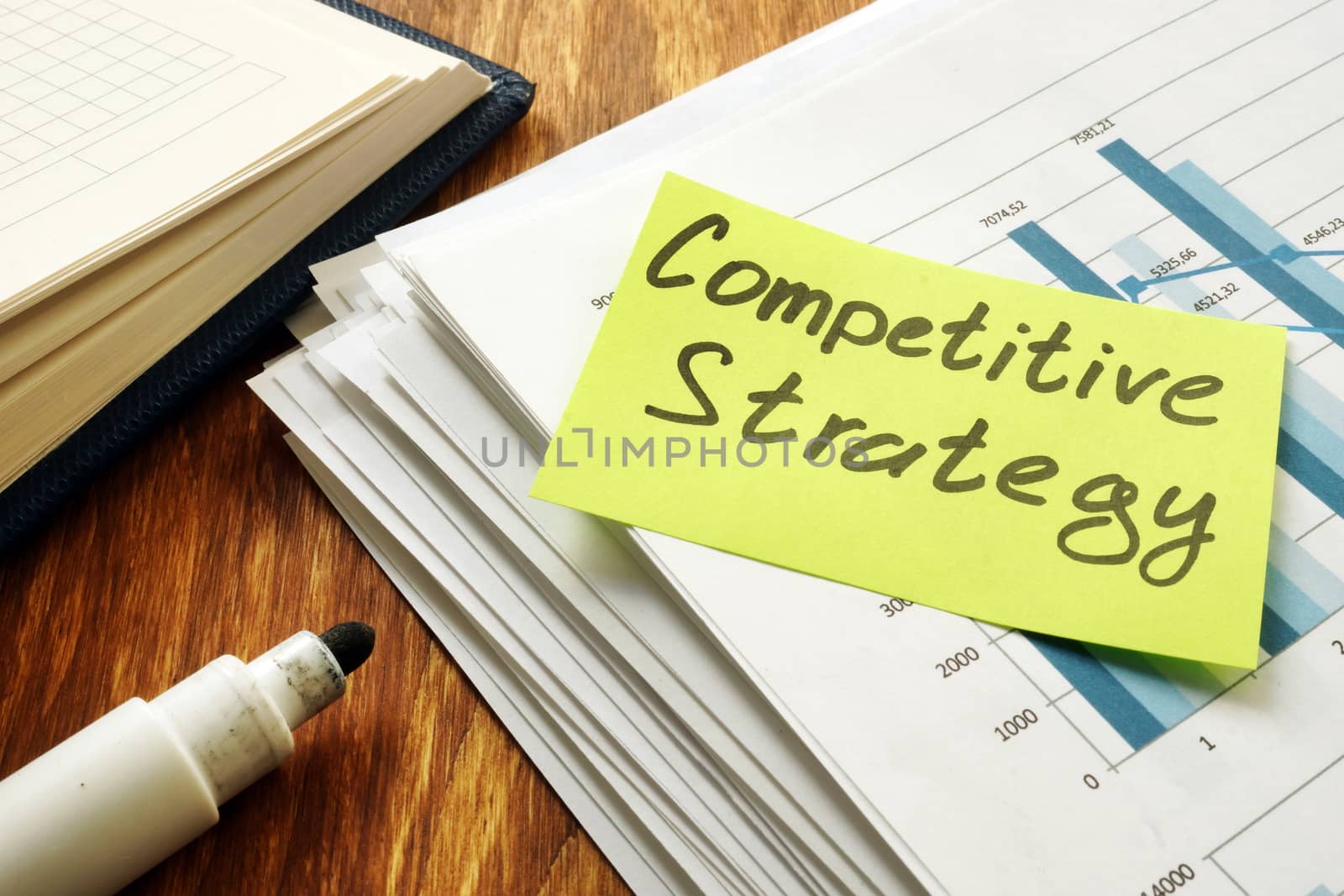Competitive Strategy business papers on desk.