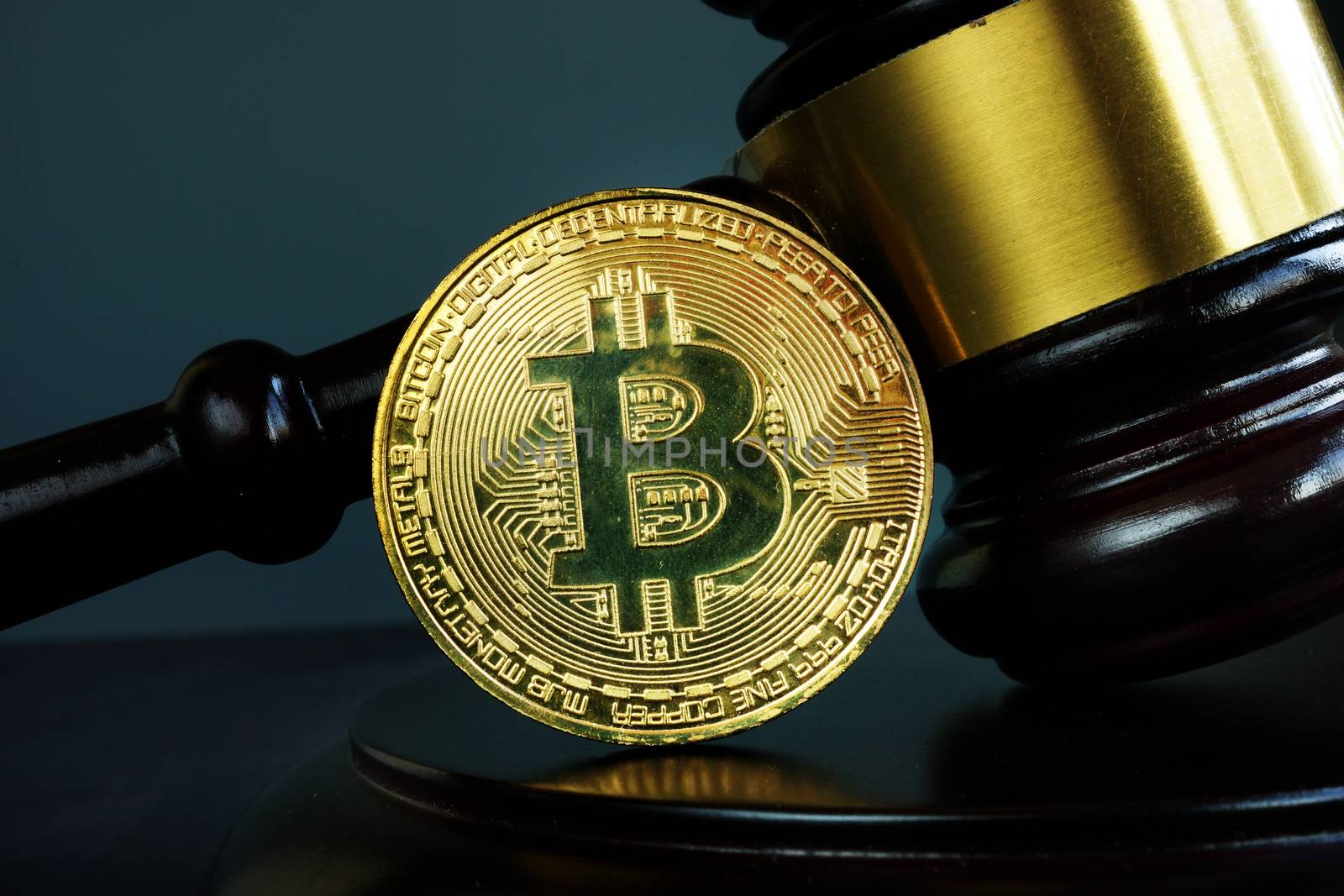 Gavel and Bitcoin coin. Crypto law and regulation of cryptocurrency.