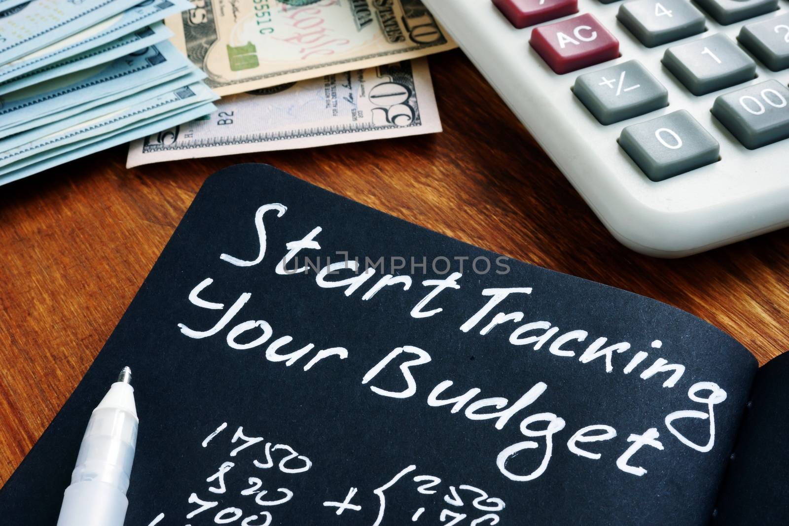 Start tracking your budget sign with home finances calculations. by designer491