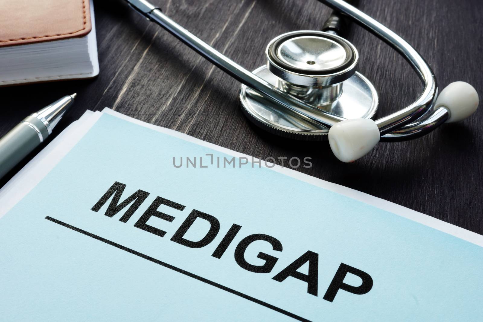 Medigap Medicare Supplement Health Insurance papers and stethoscope.