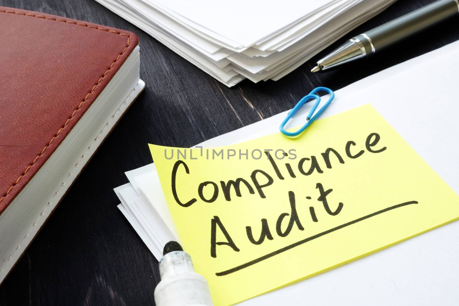 Compliance audit concept. Stack of papers in the office. by designer491