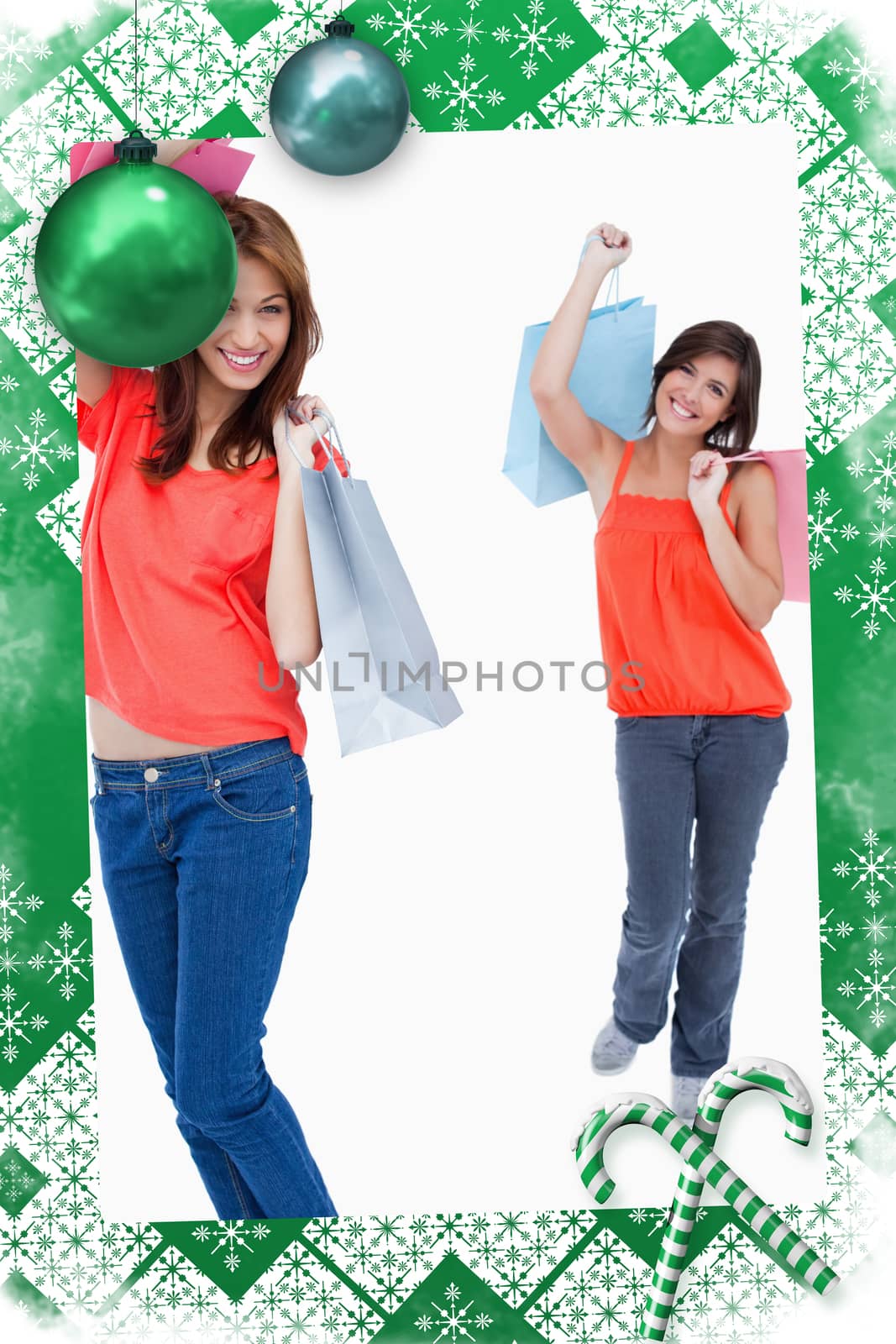 Teenage girl following her friend after shopping against a white background by Wavebreakmedia