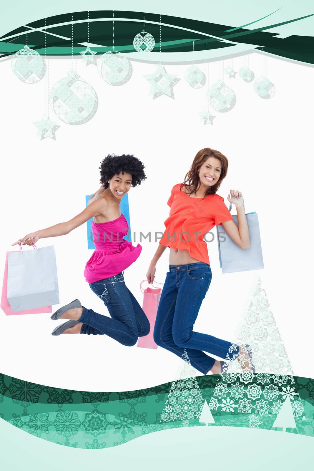 Young teenagers energetically jumping after going shopping against christmas frame