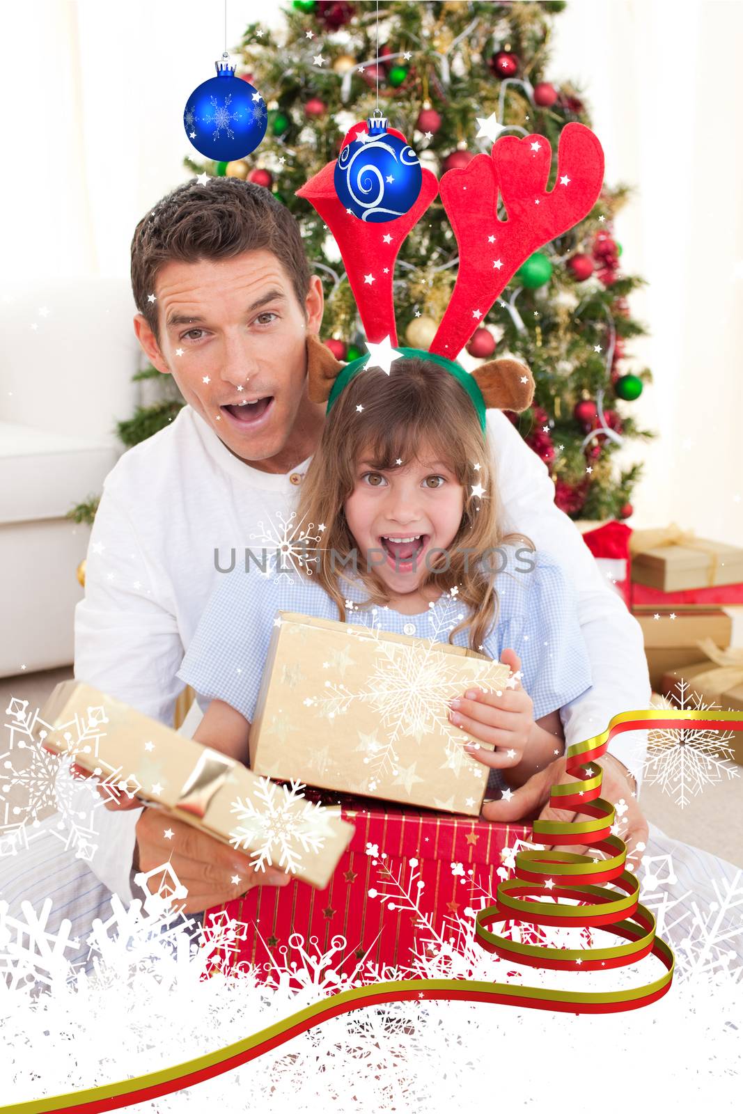 Surprised father and his girl opening Christmas gifts against twinkling stars