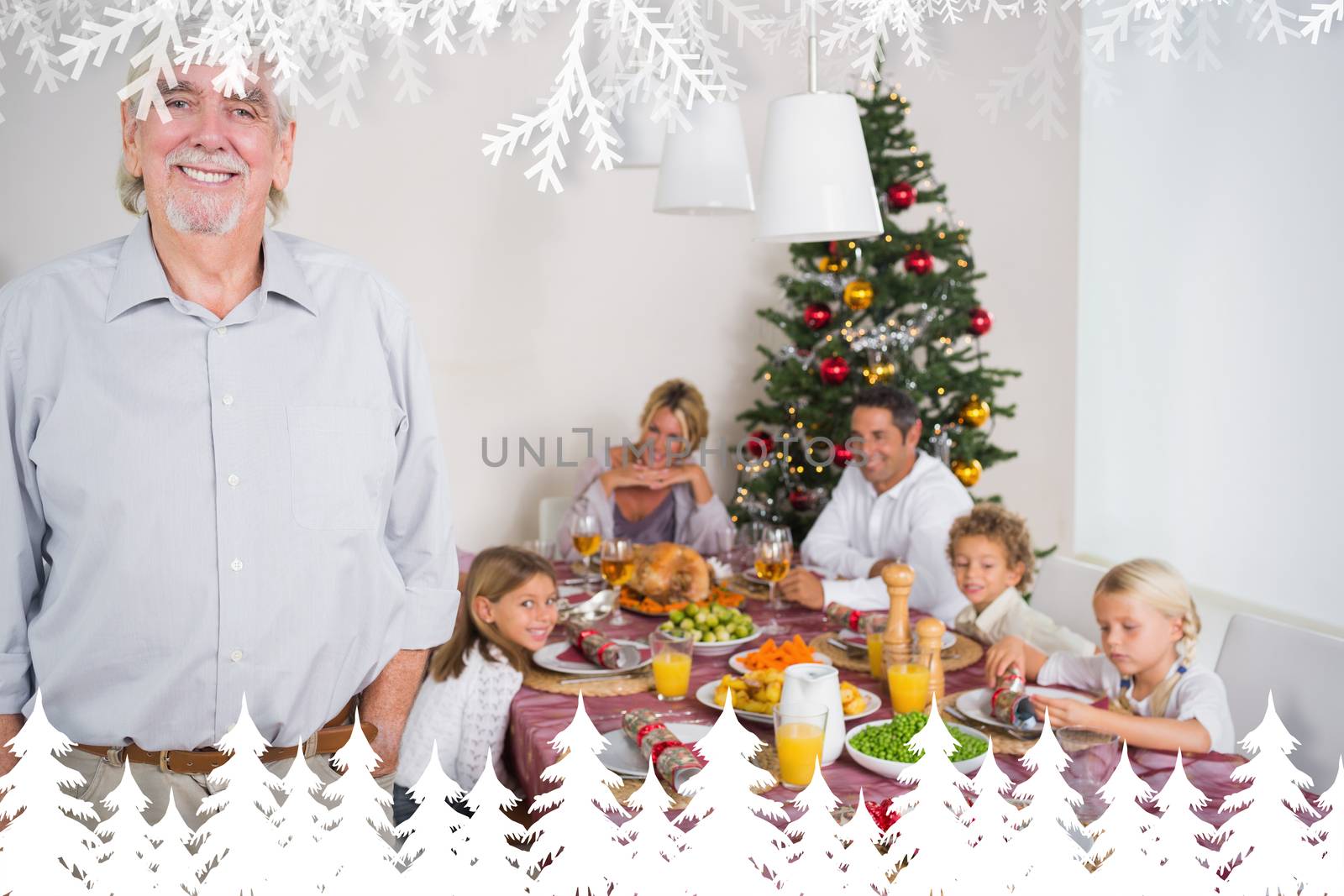 Composite image of smiling grandfather standing at the dinner table by Wavebreakmedia