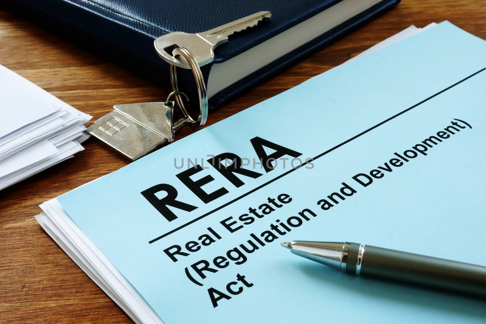 RERA or Real Estate Regulation and Development Act on the desk and key. by designer491