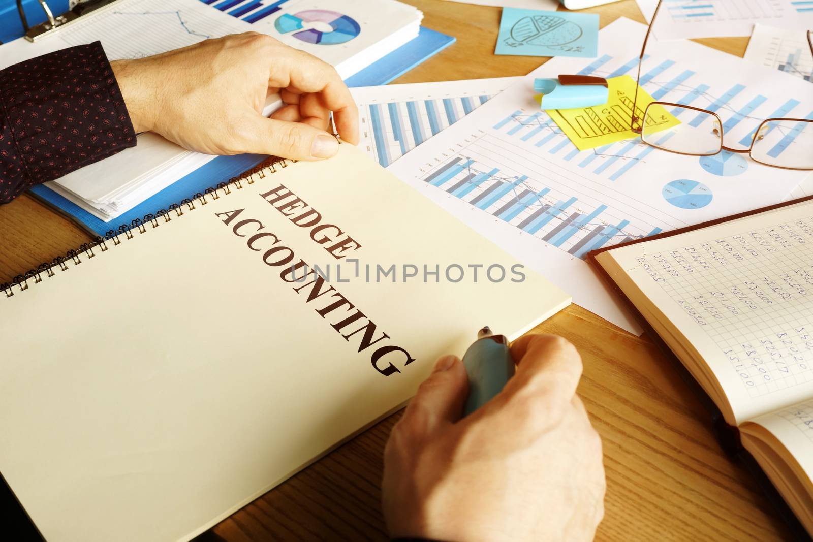 Hedge accounting report and financial papers on the desk. by designer491