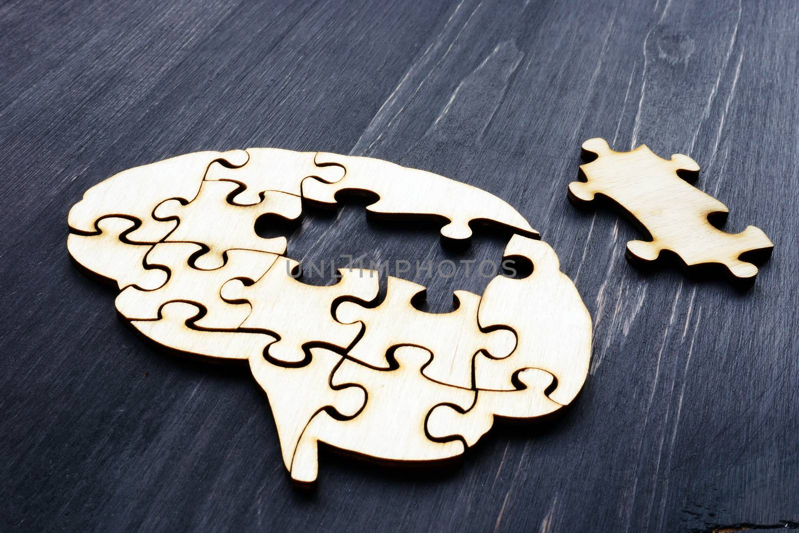 Brain from wooden puzzles. Mental Health and problems with memory. by designer491