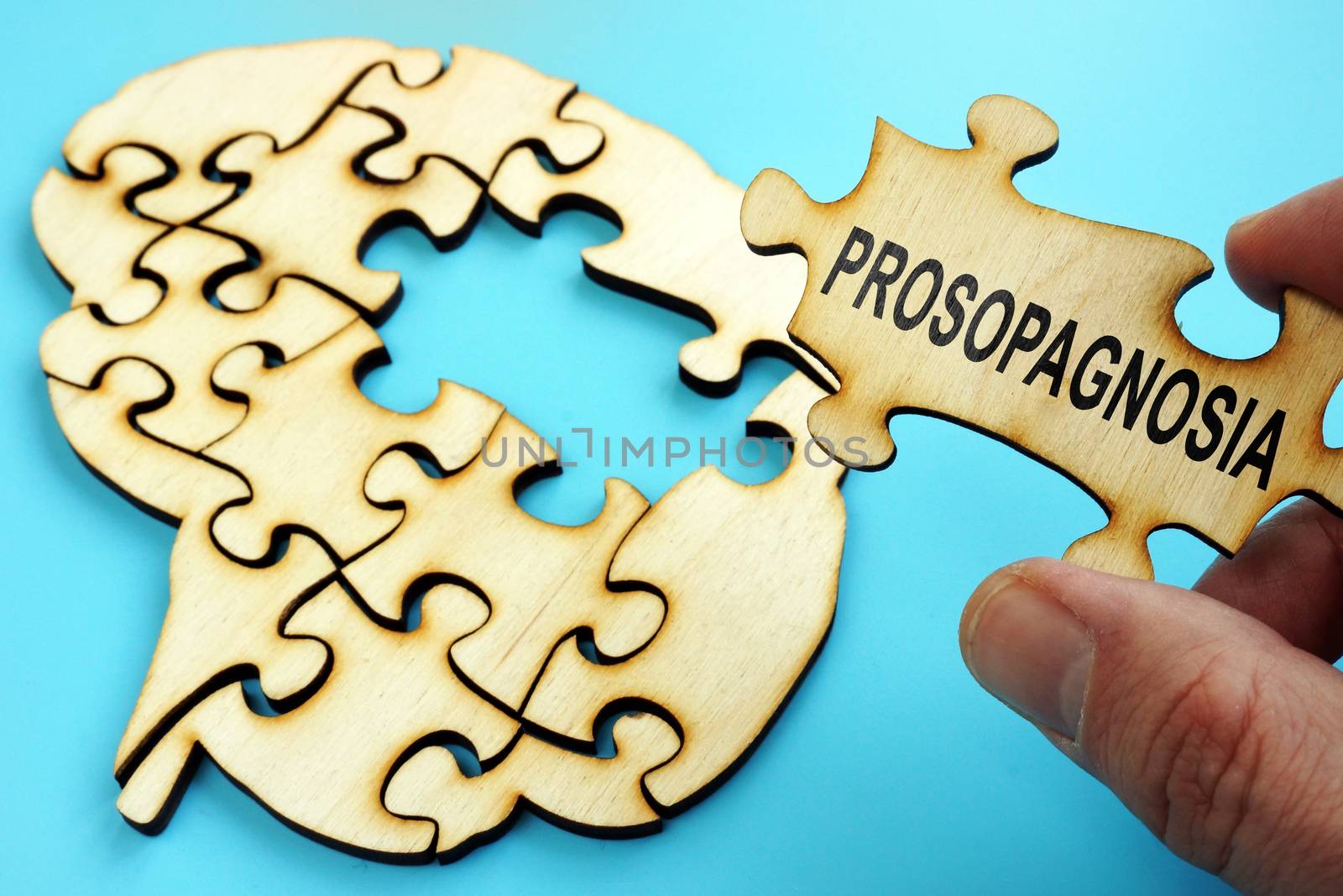 Prosopagnosia written on the piece of puzzle. by designer491