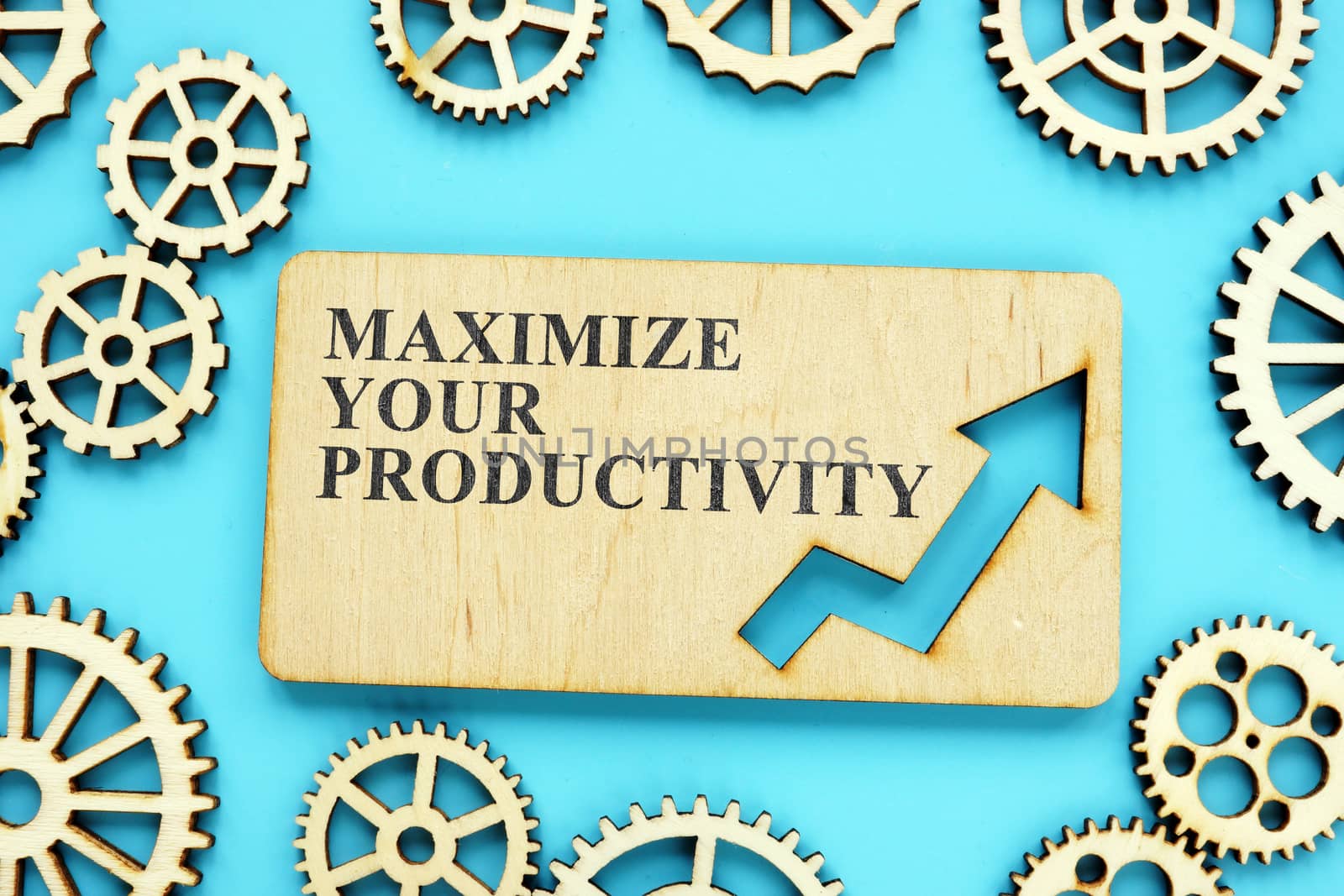 Maximize Your Productivity phrase on the wooden plate and gears. by designer491