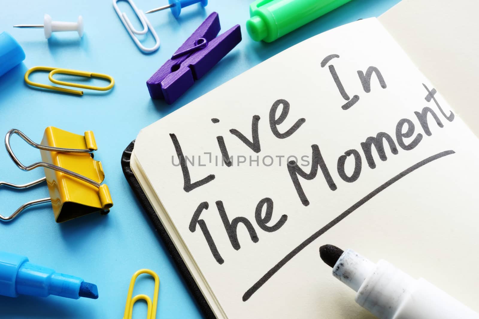 Live in the Moment handwritten phrase in the note. by designer491