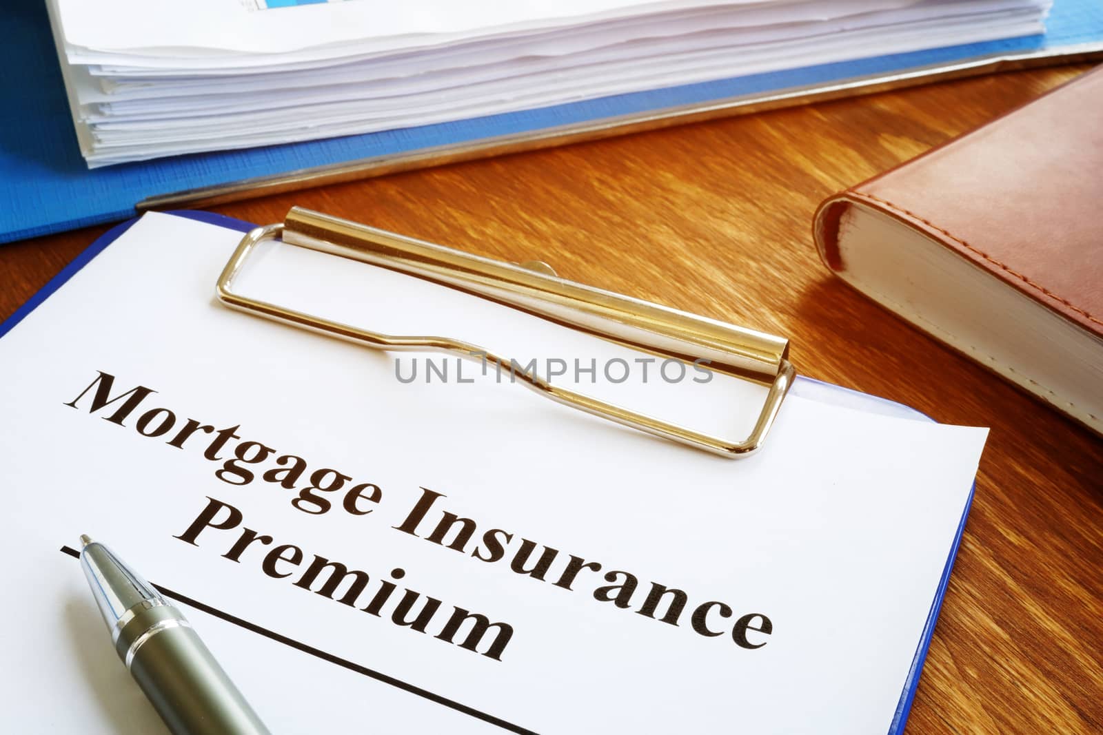 Mortgage Insurance Premium MIP with stack of documents.